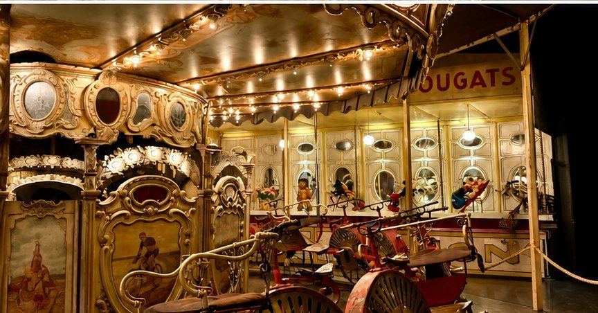Antique gilded carousel and the 1897 bicycle merry-go-round at the Musée des Arts Forains in Bercy, Paris
