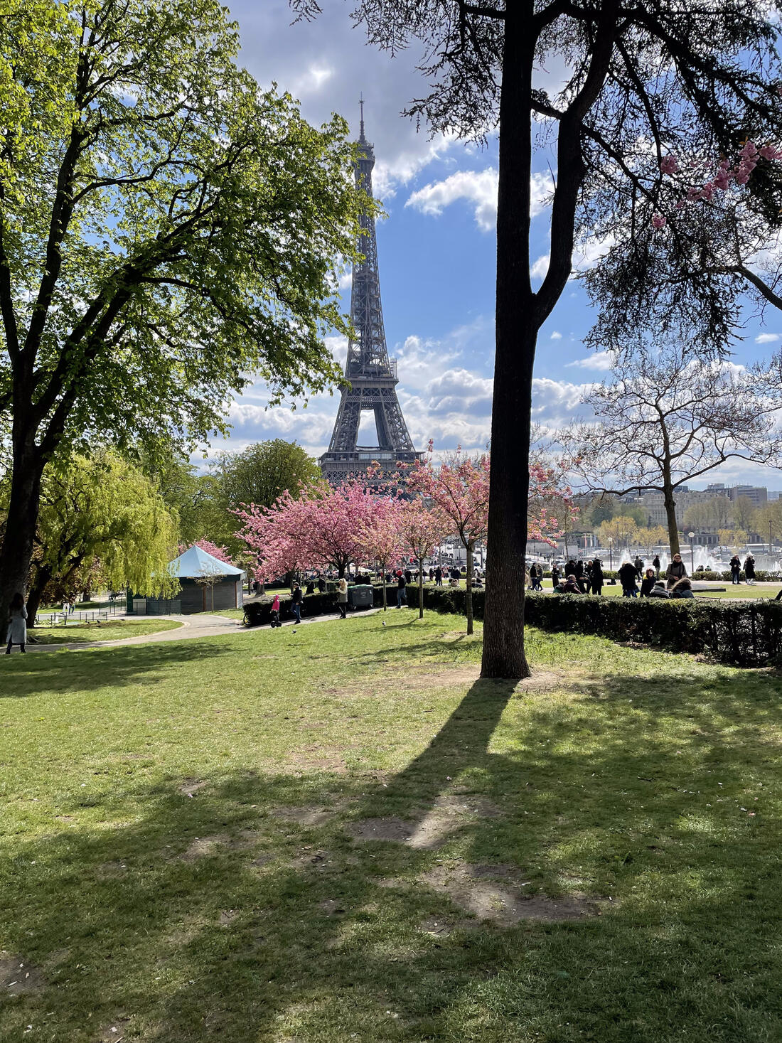 A child looking up at the Eiffel Tower from the esplanade below, Paris