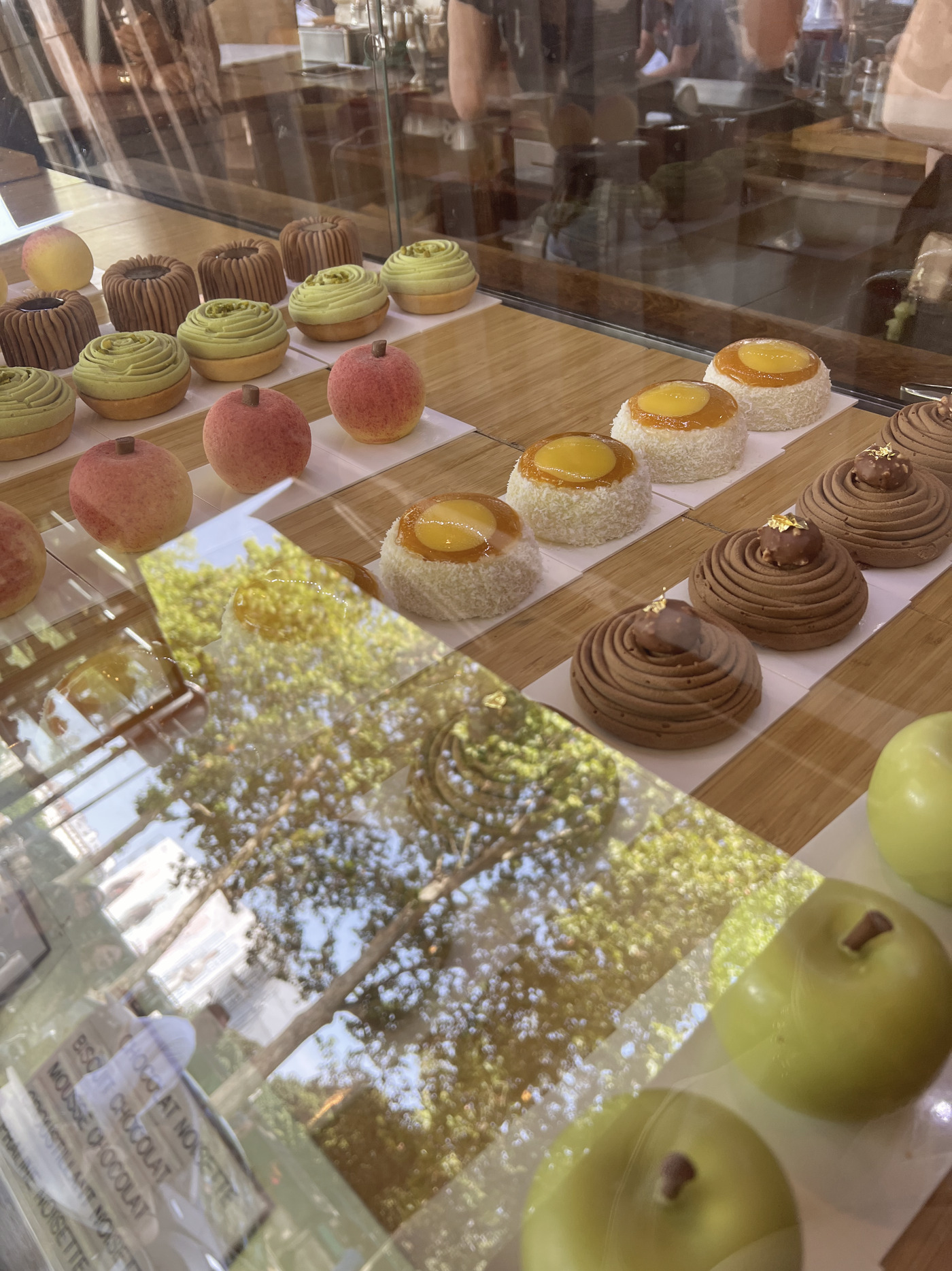 A Paris pâtisserie window full of colourful tarts and pastries