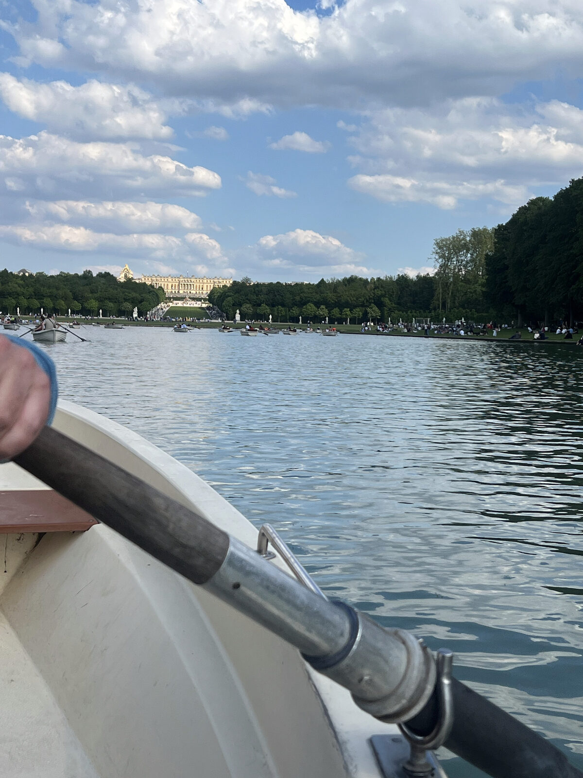 View from a rowboat on the Grand Canal at Versailles, the palace in the distance